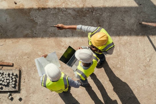 Site team reviewing plans before work starts